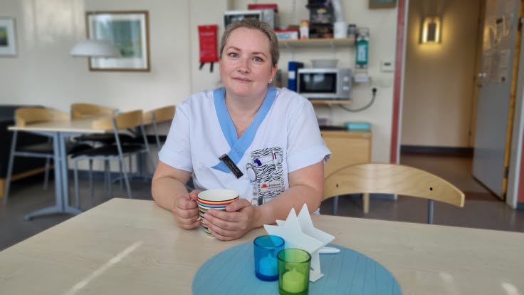 Porträtt av Johanna Lindmark Larsson i arbetskläder.